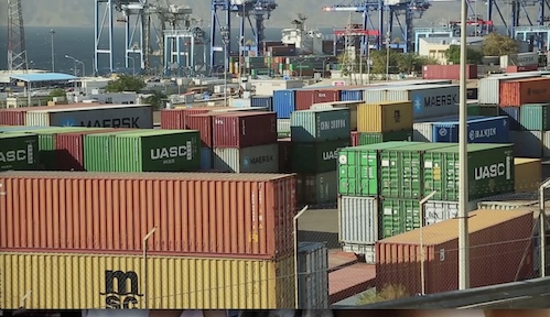 A New Era of Chaos and Distrust is Shaping: Trade wars - cargo containers, exports delivery stops.