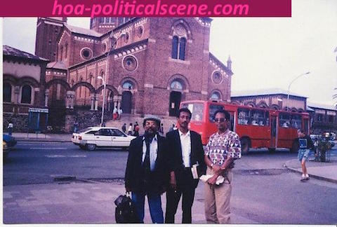 hoa-politicalscene.com/asmara.html - Asmara: Main street and Cathedral view with journalist Khalid Mohammed Osman, his brother chancellor Mubarak and his friend artist Salih Tahir stading.