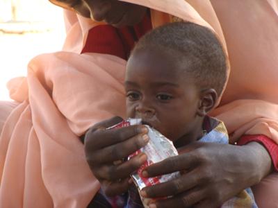 Darfur child receiving a nutritional supplement